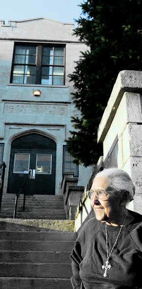 Bloomington civic leader Elizabeth Eagleson Bridgwaters stands outside the Banneker Community Center on West Seventh Street in 1997. She died in 1999 at the age of 90, and later that year Herald-Times readers voted her Monroe County Woman of the Century for her leadership in the areas of education, civil rights, religion and social services.