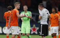 Germany's Julian Draxler, right, reacts disappointed beside Netherland's Matthijs de Ligt, left, after the UEFA Nations League soccer match between The Netherlands and Germany at the Johan Cruyff ArenA in Amsterdam, Saturday, Oct. 13, 2018. The Netherlands defeated Germany with 3-0. (AP Photo/Peter Dejong)