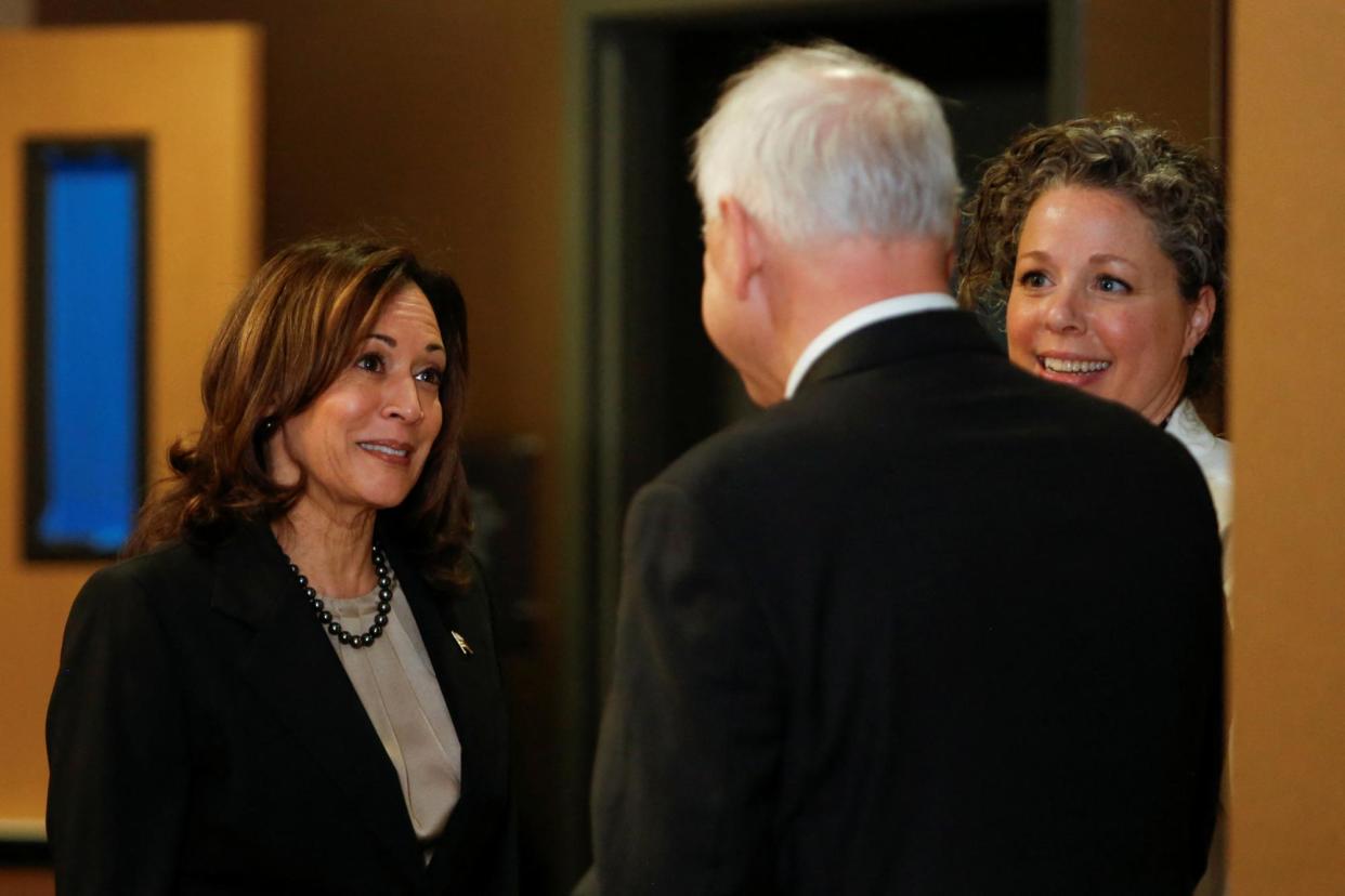 <span>Kamala Harris speaks with Dr Sarah Traxler and Minnesota governor Tim Walz as she visits an abortion clinic in St Paul on Thursday.</span><span>Photograph: Nicole Neri/Reuters</span>