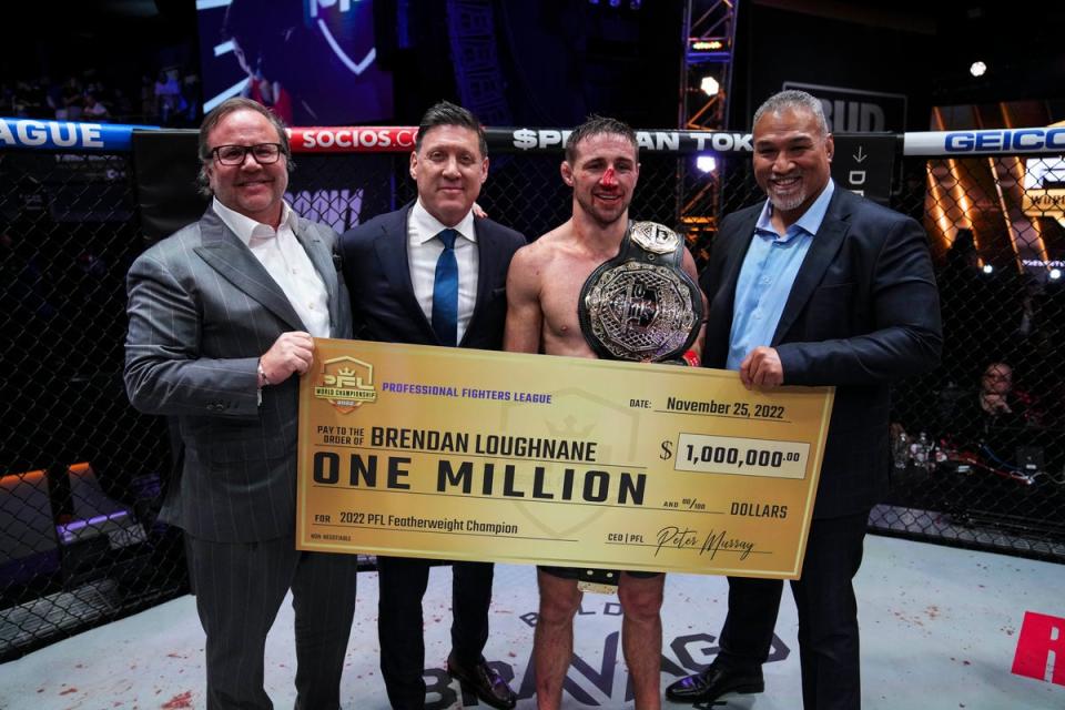 Loughnane receives his winner’s cheque at the Hulu Theater in Madison Square Garden (Cooper Neill / PFL)