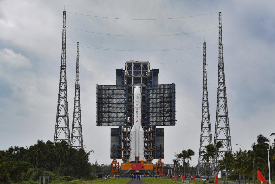 In this Nov. 17, 2020, photo released by China's Xinhua News Agency, a Long March-5 rocket is seen on the launch pad at the Wenchang Space Launch Site in Wenchang in southern China's Hainan Province. Chinese technicians were making final preparations Monday, Nov. 23, 2020, to launch a Long March-5 rocket carrying a mission to bring back material from the lunar surface in a potentially major advance for the country's space program. (Guo Cheng/Xinhua via AP)