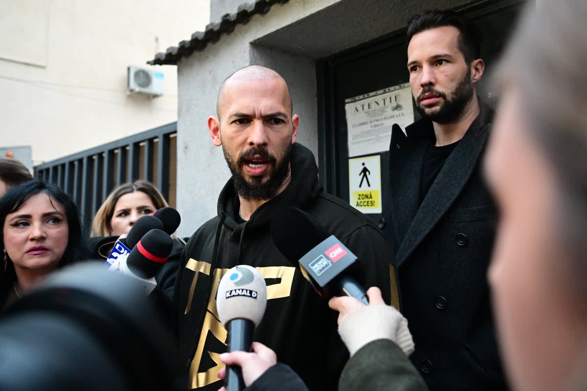 Tate and his brother Tristain are facing charges in Romania (AFP via Getty Images)