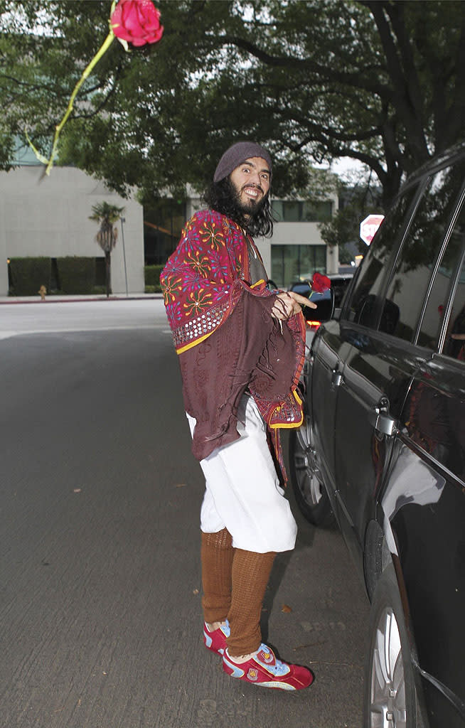 <p class="MsoNormal">Russell Brand showed his love for the paparazzi in Hollywood on Tuesday by tossing a red rose at one of the photographers. As for that outfit, it’s a little hard to wrap our heads around, but he must really like the layered look with two shirts, baggy shorts over crocheted leggings, a knit hat, and a colorful blanket draped over his shoulders. Clearly, he's not worried about keeping a low profile! (5/1/2012)</p>