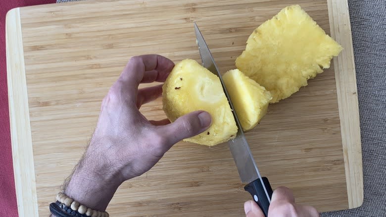 pineapple being sliced 