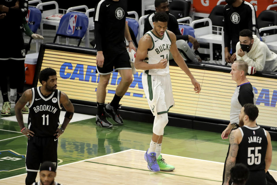 Milwaukee Bucks' Giannis Antetokounmpo pumps his fist after making a shot during the second half of an NBA basketball game against the Brooklyn Nets Tuesday, May 4, 2021, in Milwaukee. (AP Photo/Aaron Gash)