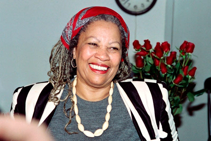 Toni Morrison smiles in her office at Princeton University in New Jersey, while being interviewed by reporters on October 7, 1993.