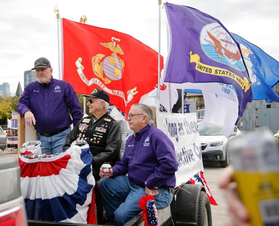 Jim Lee (retired Navy) and Rick Trice ride with World War II, Korea and Vietnam vet Charles Braun (retired Air Force) on the Elks Lodge No. 124 float.