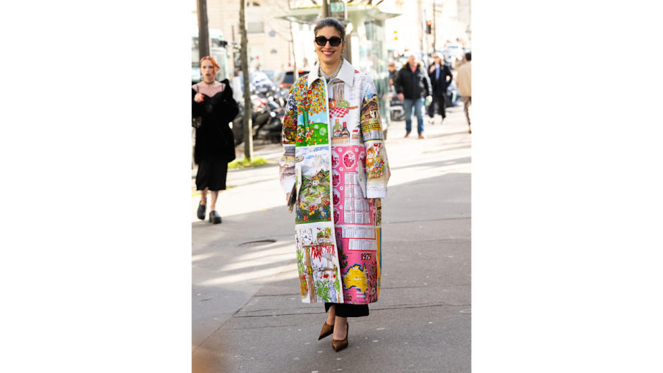 Caroline Issa wears a stunning patchwork Marine Serre coat during Paris Fashion Week.