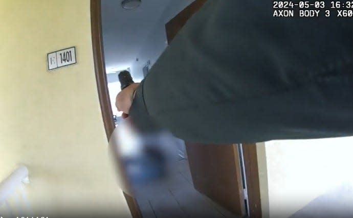 In a screen shot, an Okaloosa County Sheriff's Office deputy is shown in body cam video immediately after shooting U.S. Air Force Special Operations Senior Airman Roger Fortson at his Okaloosa County apartment outside of Fort Walton Beach, Florida.