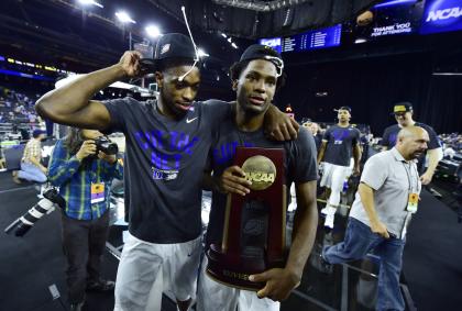 Justise Winslow (R) and Amile Jefferson walk off the court with the regional championship trophy. (USA TODAY Sports)