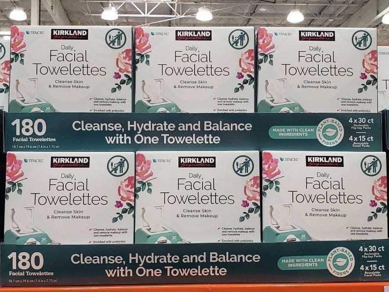 stacked white boxes of kirkland's facial towelettes at Costco