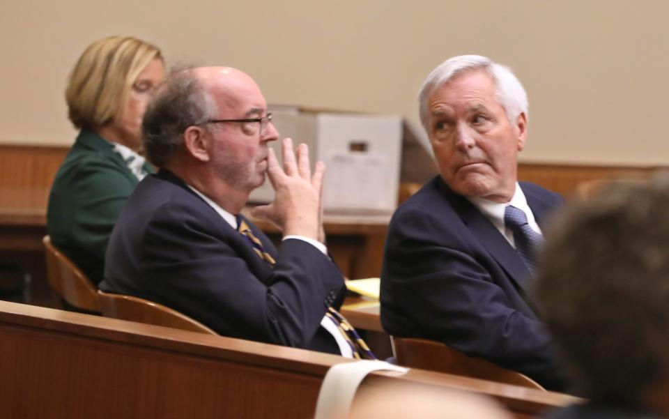 James Krauseneck Jr., right, with his defense attorney William Easton, looks back at his family members seated in the gallery during opening statements in his murder trial at the Hall of Justice in Rochester Tuesday, Sept. 6, 2022. Krauseneck is accused of killing his wife Kathleen in 1982 using an ax.
(Photo: Shawn Dowd, Democrat and Chronicle)