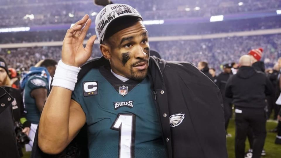 Philadelphia Eagles quarterback Jalen Hurts walks on the field Jan. 29 after the NFC Championship NFL game in Philadelphia between the Eagles and the San Francisco 49ers. The Eagles’ 31-7 victory sent them to the Super Bowl. Off the field, Hurts was earning a master’s degree. (Photo: Seth Wenig/AP)