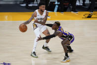 Los Angeles Lakers guard Dennis Schroeder, right, defends against New Orleans Pelicans guard Nickeil Alexander-Walker during the second quarter of an NBA basketball game Friday, Jan. 15, 2021, in Los Angeles. (AP Photo/Ashley Landis)