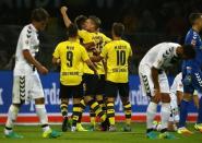 Football Soccer - Borussia Dortmund v SC Freiburg - German Bundesliga - Signal Iduna Park, Dortmund, Germany - 23/09/16 Lukasz Piszczek of Borussia Dortmund celebrates goal against SC Freiburg with team. RUTERS/Thilo Schmuelgen