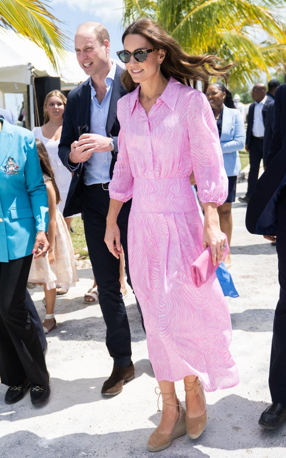 Catherine, Duchess of Cambridge wears a pink dress by Rixo during her visit to Abaco on March 26, 2022 in Great Abaco, Bahamas