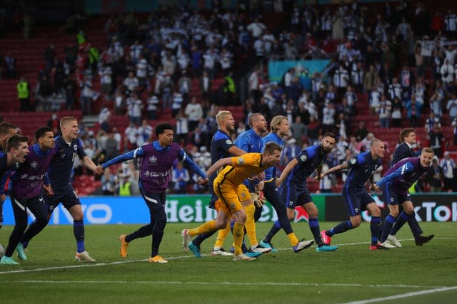 Finland players celebrate with their fans after the Euro 2020 win over Denmark in Copenhagen