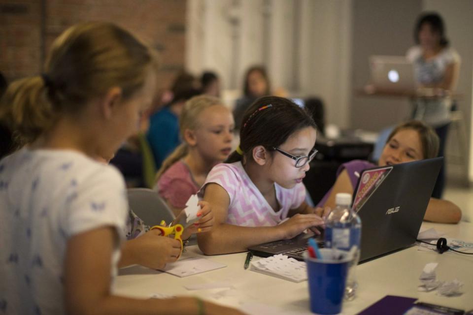 Students attend the Girls Learning Code computer workshop in Toronto on Wednesday July 16, 2014. It's one of many programs striving to open the door to girls who want to pursue science, technology, math and engineering. Photo from The Canadian Press