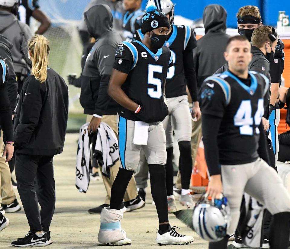 Carolina Panthers Teddy Bridgewater (5) walks with his right foot wrapped along the sideline during the fourth quarter against the New Orleans Saints Sunday. Bridgewater was benched in the third quarter in Carolina’s 33-7 loss.