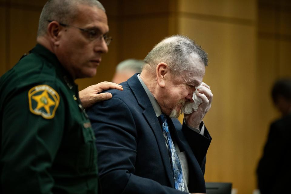 David Marshall Murdock wipes his tears as he is led out of the courtroom during a short recess after jurors were shown the autopsy photos of his former girlfriend, Lisa Bunce, during his first-degree murder trial in Bartow on Monday. Murdock is charged with the murder of Bunce and attempted murder of Sanda Andrews in 2019 at Andrews' home in Haines City.