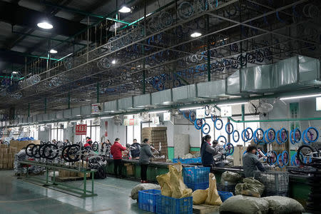 Employees work on the production line of Kent bicycles at Shanghai General Sports Co., Ltd, in Kunshan, Jiangsu Province, China, February 22, 2019. Picture taken February 22, 2019. REUTERS/Aly Song