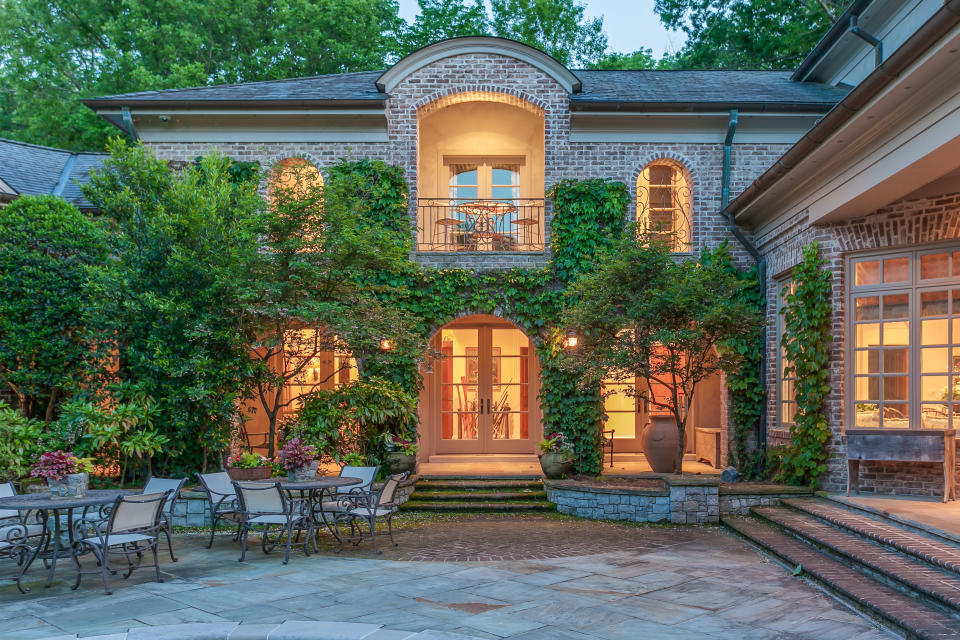 Outside, you'll find even more space for entertaining, as well as a brick cabana with a fireplace, and a two-stall barn. (The Agency)