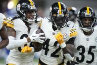 Pittsburgh Steelers cornerback James Pierre (42) celebrates an interception during the first half of an NFL football game against the Indianapolis Colts, Monday, Nov. 28, 2022, in Indianapolis. (AP Photo/Michael Conroy)