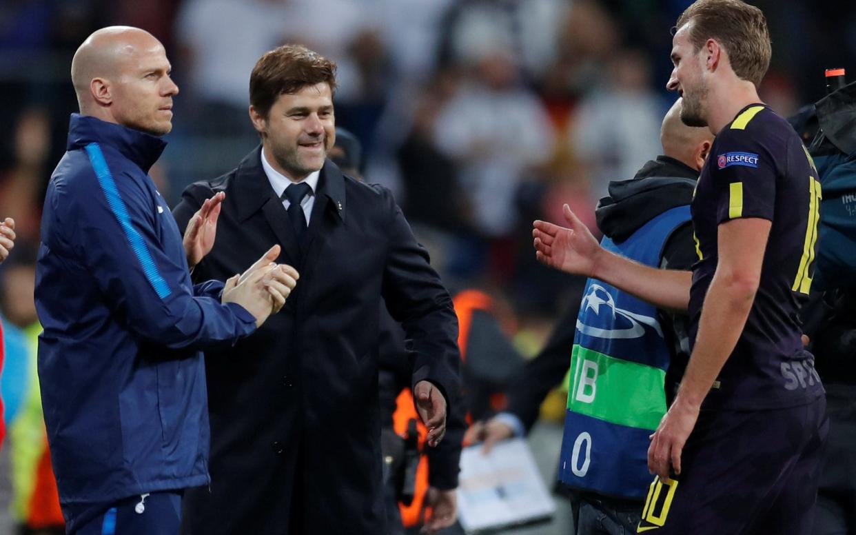 Mauricio Pochettino (C) was delighted with his side's draw at Real Madrid 