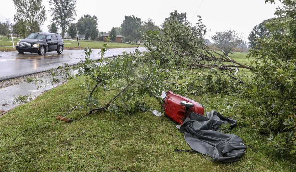 A wagon and a grill cover lays among downed trees after a tornado swept through Stanley, Ky., Saturday, Sept. 8, 2018. (Greg Eans/The Messenger-Inquirer via AP)