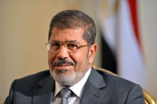 Egypt's Supreme Constitutional Court said that all of its rulings were "binding," in response to a presidential decree by Mohamed Morsi, seen here on July 8, reinstating parliament after the court ruled the house invalid