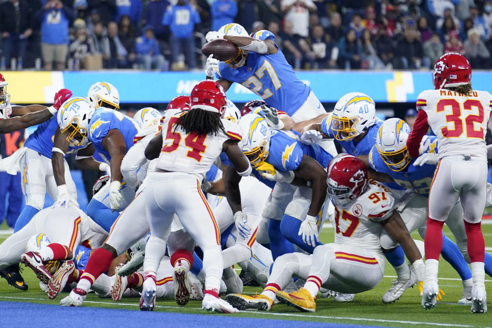 Los Angeles Chargers running back Joshua Kelley, above, fumbles the ball during the second half of an NFL football game against the Kansas City Chiefs, Thursday, Dec. 16, 2021, in Inglewood, Calif. (AP Photo/Marcio Jose Sanchez)