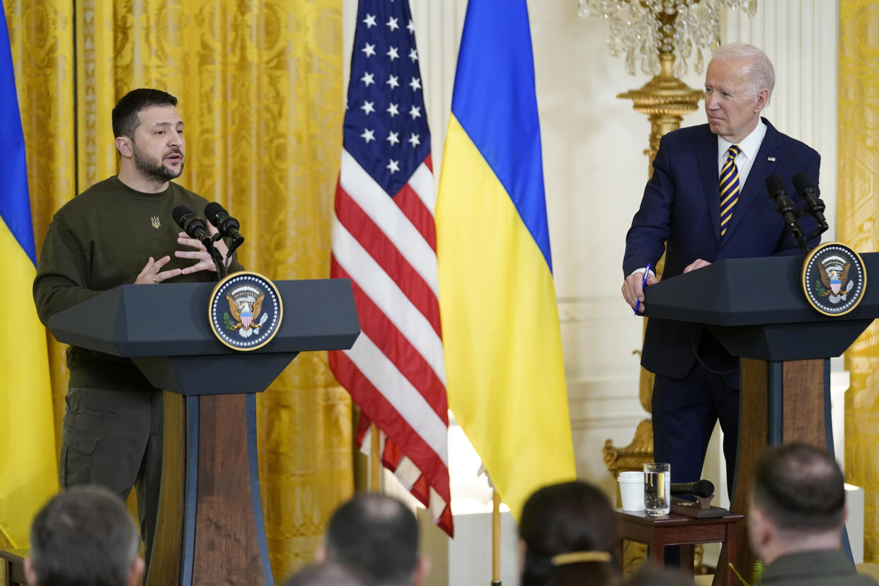 President Joe Biden listens as Ukrainian President Volodymyr Zelenskyy speaks during a news conference in the East Room of the White House in Washington, Wednesday, Dec. 21, 2022. (AP Photo/Andrew Harnik)