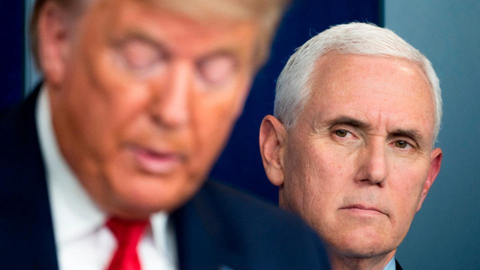 PHOTO: Vice President Mike Pence listens as President Donald Trump speaks during a press briefing at the White House in Washington, DC, on March 26, 2020. (Jim Watson/AFP via Getty Images, FILE)