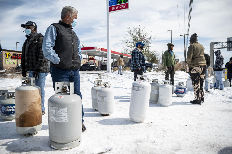 AUSTIN, TX- FEB 16: Customers wait in line to get their propane tanks filled in Austin, TX on Tuesday, Feb. 16, 2021. A weekend snowstorm coated the roads in Texas in snow and ice and left many without power. Without proper tools to remove it many roads are still covered in snow and ice. (Sergio Flores for The Washington Post via Getty Images)
