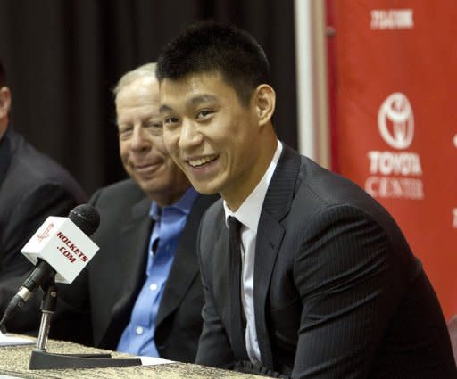 Jeremy Lin of the Houston Rockets speaks to the media as he is introduced during a press conference at Toyota Center, on July 19, in Houston, Texas. Lin has signed a three year $25 mln contract with the Rockets