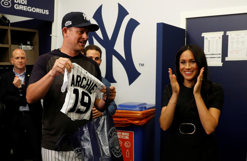 The Duke and Duchess of Sussex receive presents for their son Archie as they meet players of the New York Yankees as they attend the Boston Red Sox vs New York Yankees baseball game at the London Stadium in support of the Invictus Games Foundation.