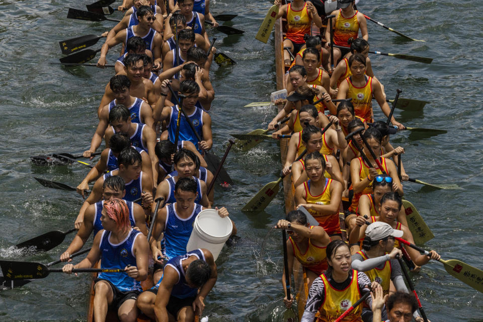 Competitors take part in the annual dragon boat race to celebrate the Tuen Ng festival in Hong Kong, Thursday, June 22, 2023. (AP Photo/Louise Delmotte)