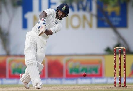 Cricket - Sri Lanka v India - First Test Match - Galle, Sri Lanka - July 26, 2017 - India's cricketer Shikhar Dhawan plays a shot. REUTERS/Dinuka Liyanawatte
