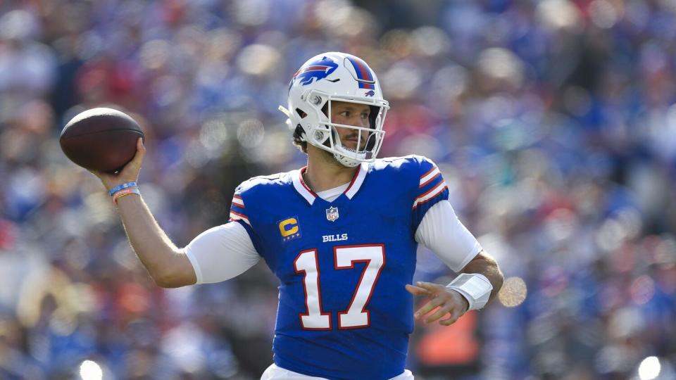 Buffalo Bills quarterback Josh Allen (17) readies to throw a pass against the Dolphins.