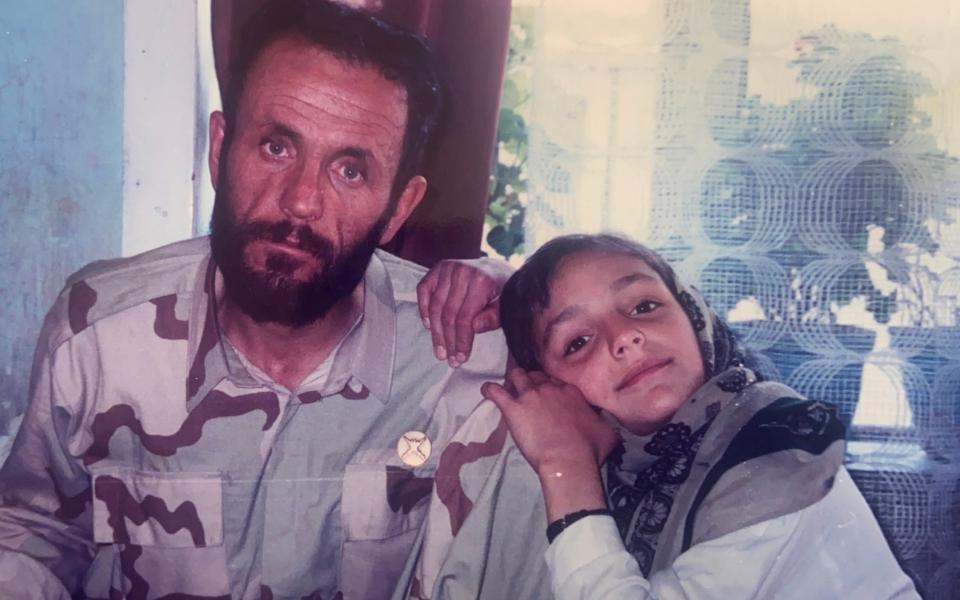 Ms Gharfari with her father, Abdul Wasi Ghafari, an Afghan Army colonel who was killed aged 53 - Zarifa Ghafari