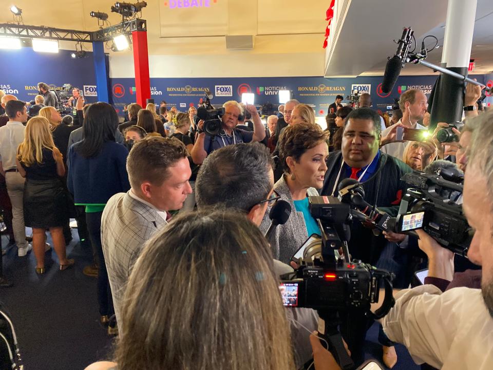 Kari Lake, the Republican who lost the Arizona gubernatorial race last year, takes questions from reporters in the spin room.