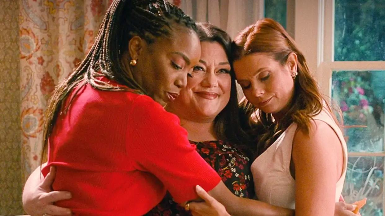  Heather Headley as Helen, Brooke Elliott as Dana Sue and Joanna Garcia Swisher as Maddie hug in Sweet Magnolias 