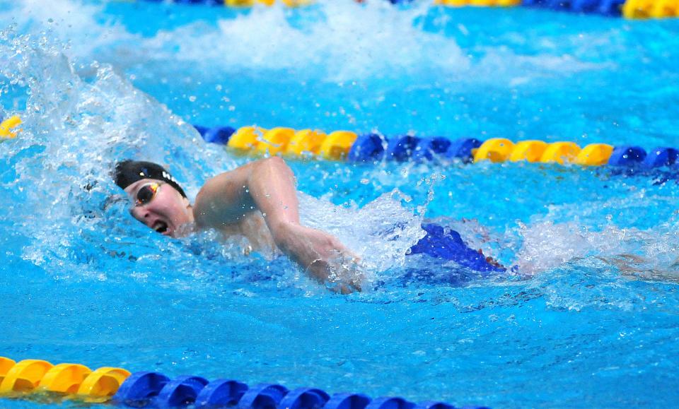 Ashland High School’s Amber Harry competes in the 100-yard freestyle during the Ohio Cardinal Conference Championships at Wooster High School Saturday, Jan. 15, 2022.