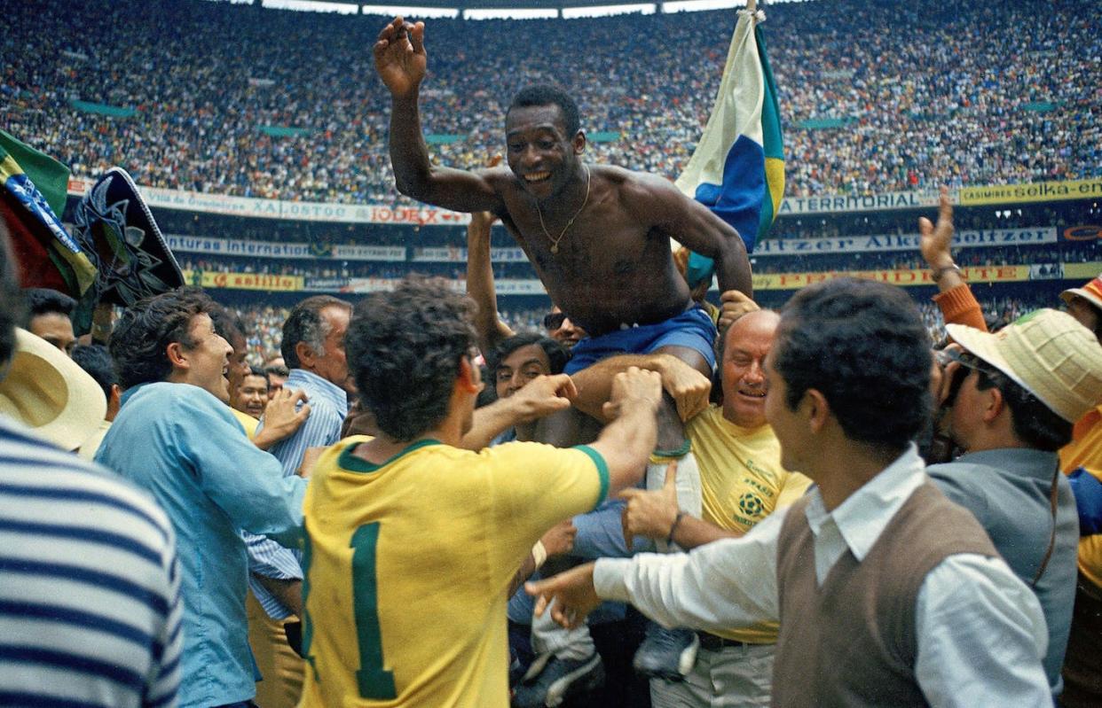 Held aloft as the embodiment of the beautiful game. <a href="https://www.gettyimages.com/detail/news-photo/edson-arantes-do-nascimento-pele-of-brazil-celebrates-the-news-photo/1227541383?phrase=pele&adppopup=true" rel="nofollow noopener" target="_blank" data-ylk="slk:Alessandro Sabattini/Getty Images;elm:context_link;itc:0;sec:content-canvas" class="link ">Alessandro Sabattini/Getty Images</a>