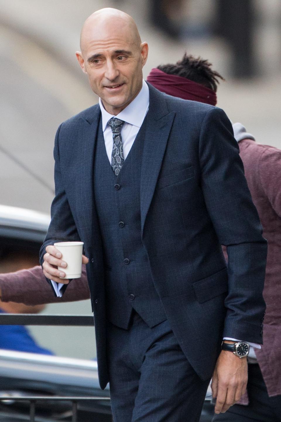 <p>Mark Strong looks sharp while filming an episode of the TV series <i>Temple</i> in London on Monday.</p>