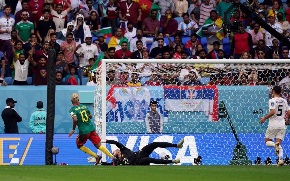 Cameroon's Eric Maxim Choupo-Moting scores their side's third goal - PA