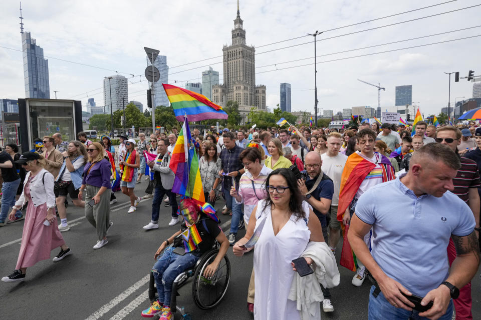 People take part in Poland's yearly Pride parade, known as the Equality Parade, in Warsaw, Poland, on Saturday June 17, 2023. Parents of trans children are mobilizing in Poland seeking acceptance after the country’s leader mocked trans people last year during Pride season. Poland has been ranked as the worst country in the European Union for LGBTQ+ rights. (AP Photo/Czarek Sokolowski)