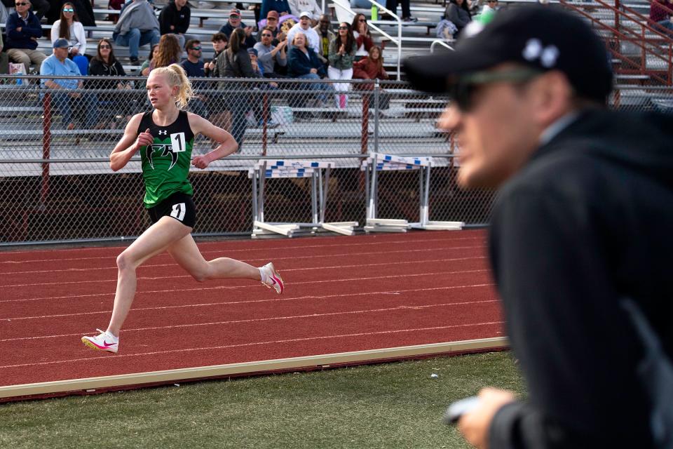Fossil's Tatum Berg eyes the finish line during the girls 1,600-meter run at the Randy Yaussi PSD city championship track and field meet on April 9 at French Field in Fort Collins.