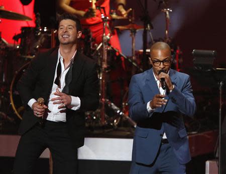 Robin Thicke (L) performs "Blurred Lines" with T.I. at The Grammy Nominations Concert Live - Countdown to Music's Biggest Night event, at Nokia theatre in Los Angeles December 6, 2013. The 56th annual Grammy Awards will be presented January 26, 2014 in Los Angeles. REUTERS/Mario Anzuoni