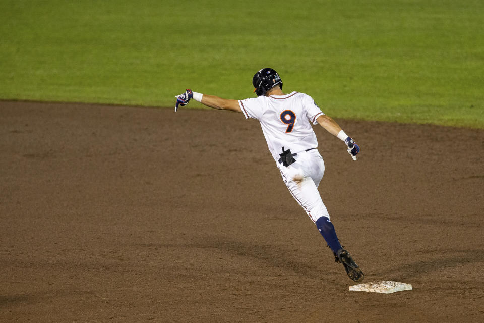 Virginia Chris Newell (9) runs the bases after hitting a two run homer in the fifth inning during a baseball game in the College World Series Thursday, June 24, 2021, at TD Ameritrade Park in Omaha, Neb. (AP Photo/John Peterson)